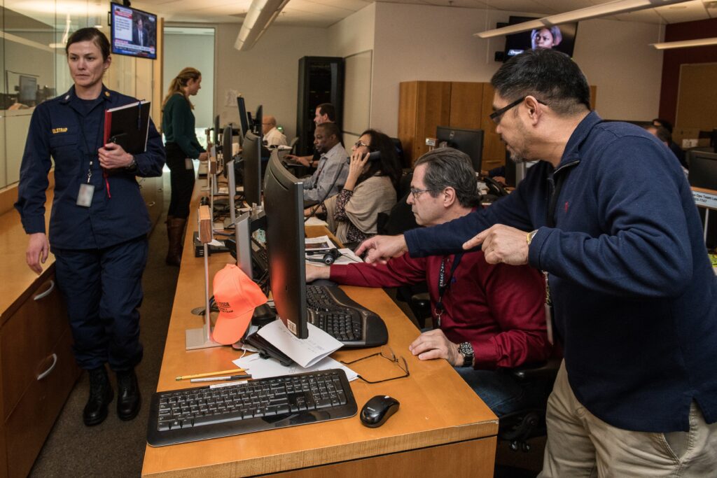 Cybersecurity professionals working in a security operations center.